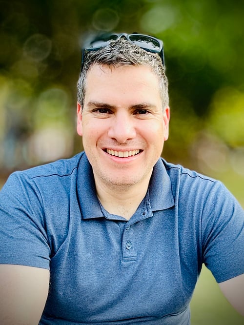 Allen Guthier in blue polo shirt and sunglasses